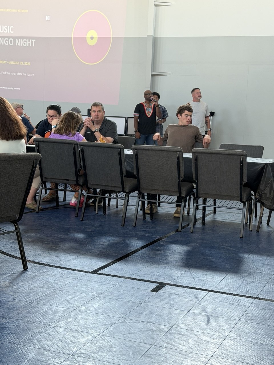 Guests playing Music Bingo together in the event room