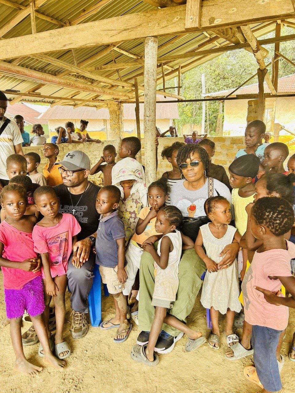 Alastair and Albertina with children in Malema Town, Liberia